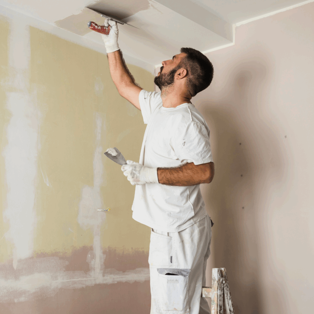 A painter applying fresh paint to a residential interior, cleanly and professionally.
